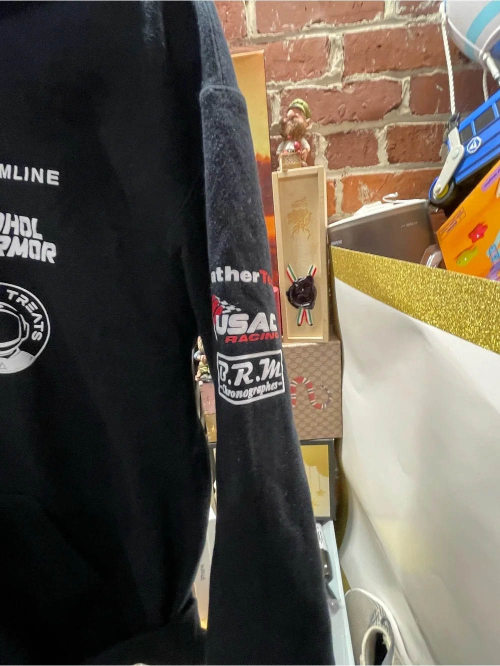 motorsport-style pullover hoodie featuring various sponsor and brand logos